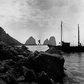 A Boat Docked At Capri by Clifford Coffin
