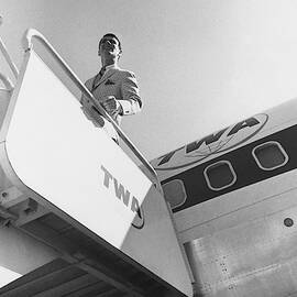 A Male Model Disembarking A Twa Boeing 707 Plane by Leonard Nones