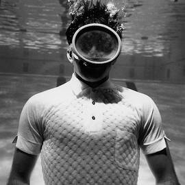 A Male Model Underwater In A Pool With A Scuba by Leonard Nones