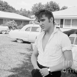 Elvis Presley with his Cadillacs by The Harrington Collection