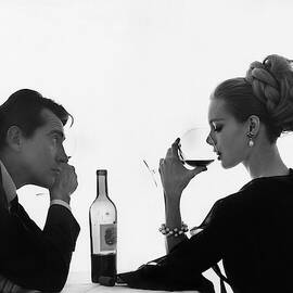 Man Gazing at Woman Sipping Wine by Bert Stern