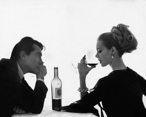 Wall Art - Photograph - Man Gazing at Woman Sipping Wine by Bert Stern
